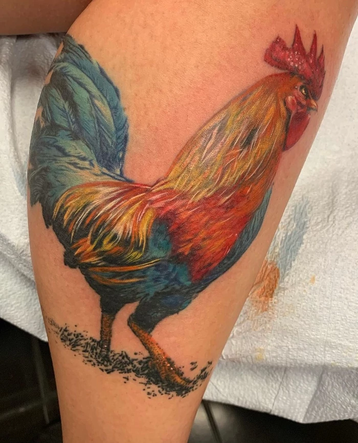 Full color rooster calf tattoo by Russ Howie of Sacred Mandala Studio in Durham, NC.